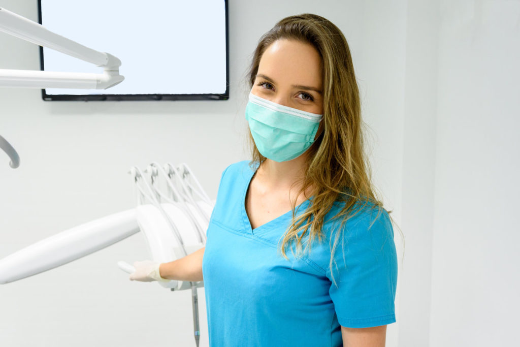 An emergency dentist in Allen wears a face mask.