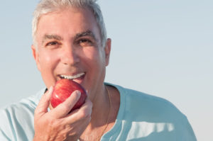 older man enjoying summer foods