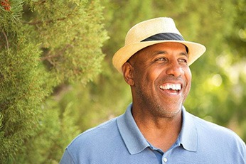 smiling man standing in nature