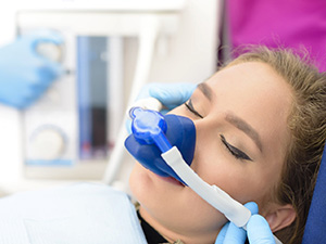 Female patient receiving nitrous oxide dental sedation in Allen, TX